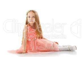 Pretty little girl posing in smart pink dress