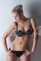 Sensual slender blonde posing in erotic lingerie