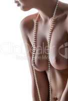 Image of elastic female breast with pearl beads