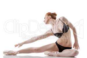 Image of emotional ballet dancer posing in studio