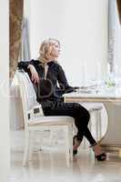 Image of elegant slim woman waits waiter