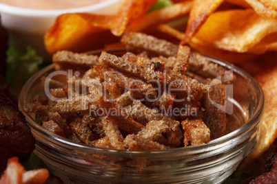 Bowl with appetizing spicy rye crackers