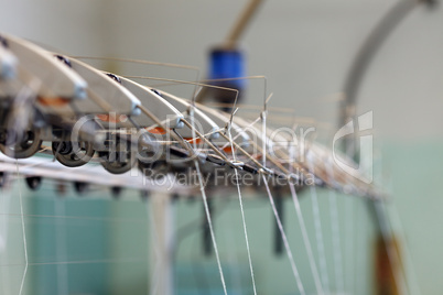 Image thread in holders on loom