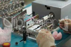 Production of knitted pompoms on factory