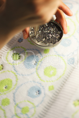 Image of gluing sequins to tissue