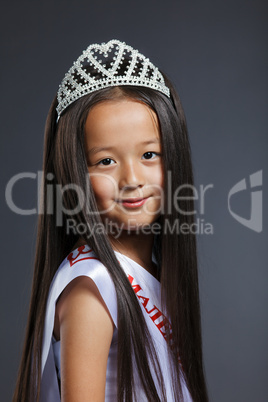 Portrait of cute little girl in precious tiara