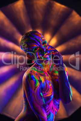 Image of dancer with futuristic UV makeup