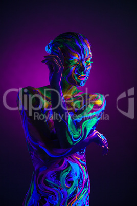 Sexual dancer posing with UV pattern on body