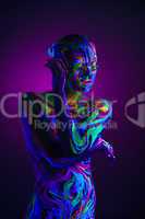 Sexual dancer posing with UV pattern on body