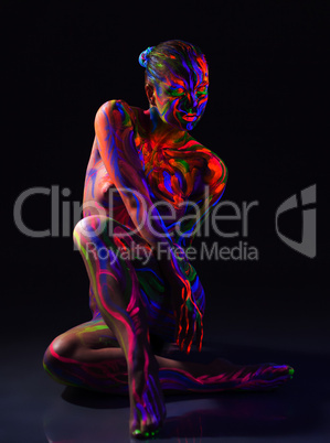 Fancy naked girl with ultraviolet pattern on body