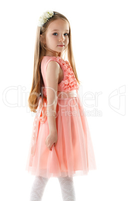 Charming little girl in pink dress and rim