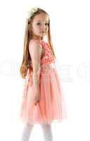 Charming little girl in pink dress and rim