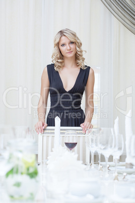 Portrait of charming girl posing in restaurant