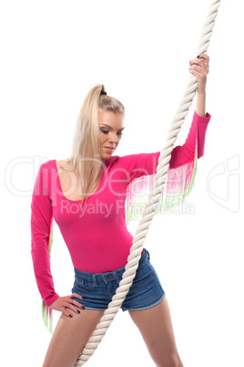 Portrait of pretty young fitness girl with rope