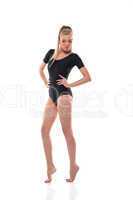 Young slim woman posing in black leotard
