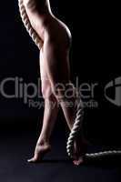 Image of sexual naked woman legs with rope