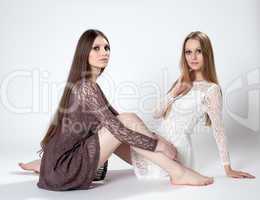 Charming models with long hair posing in dresses