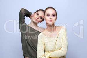 Image of young fashionable models posing in studio