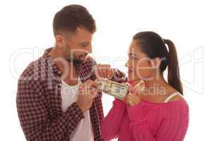 young couple holding a twenty us dollar bank note