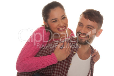 happy woman riding piggyback on the boyfriend