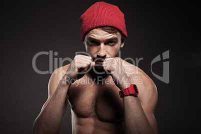 fit young man in an aggressive pose