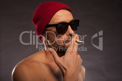 sexy man in sunglasses smoking