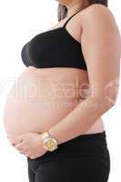 image of pregnant woman touching her belly with hands