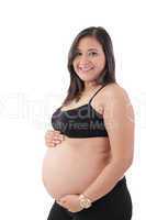 young pregnant woman smiling at camera against white background
