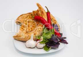 vegetables on a plate with a slice of bread