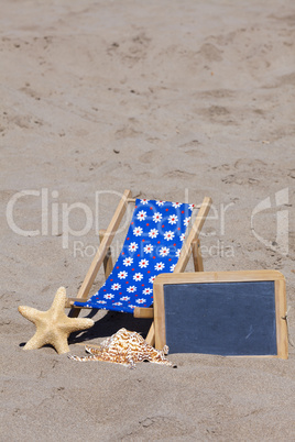 Strandliege, Seestern und eine Schiefertafel