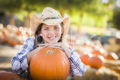 preteen girl portrait at the pumpkin patch.