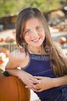 preteen girl portrait at the pumpkin patch