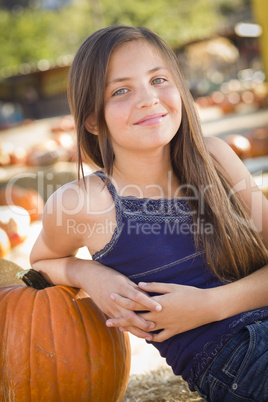 preteen girl portrait at the pumpkin patch