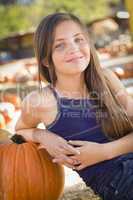preteen girl portrait at the pumpkin patch