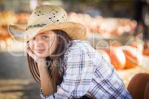 preteen girl portrait at the pumpkin patch