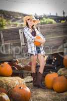 preteen girl portrait at the pumpkin patch