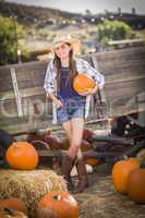 preteen girl portrait at the pumpkin patch