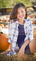 preteen girl portrait at the pumpkin patch