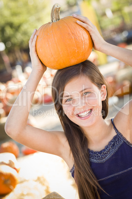 preteen girl portrait at the pumpkin patch