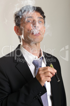 man enjoying smoking an e-cigarette