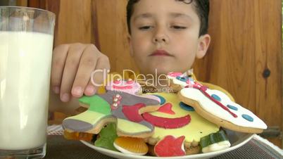 child eating yummy cookies