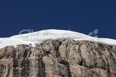 snow cornice and blue sky