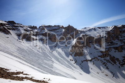 snowy mountains with trace of avalanche