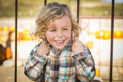 little boy playing at the park