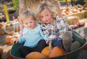 young family enjoys a day at the pumpkin patch