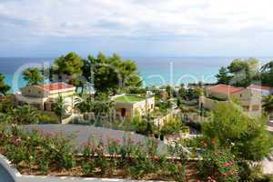 view on beach and villas at the modern luxury hotel, halkidiki,