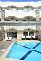 swimming pool by villa at the luxury hotel, halkidiki, greece