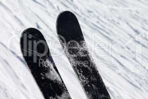 skis over off-piste slope