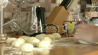 Woman hands kneading dough