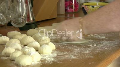 woman hands kneading dough